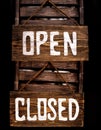 Open closed sign hanging in a door