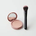 Open compact makeup container with a mirror, featuring a light pink powder. Royalty Free Stock Photo