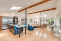 Open concept kitchen dining room and living room white walls wood floor real estate