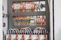 Open control panel for the power supply of the building. A modern electric box contains many wires and devices