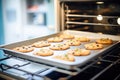 open convection oven baking cookies on a tray