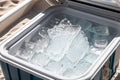 An open cooler ice melted after a day at the beach