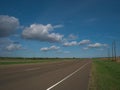 Open Country Road with No Cars on a Beautiful Sunny Day Royalty Free Stock Photo