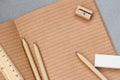 Open craft notebook, wooden stationery items , top view. Concept for education, workplace, back to school, copy space Royalty Free Stock Photo