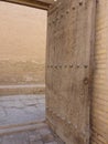 Open decorated ancient door to Khiva in Usbekistan.