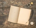 Open diary book and vintage office supplies on wooden table
