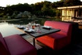 Open dinner seats at the park next to a pond Royalty Free Stock Photo