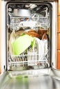 Open dishwasher with clean dishes at home kitchen Royalty Free Stock Photo