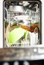 Open dishwasher with clean dishes at home kitchen Royalty Free Stock Photo