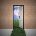 Open door from brick wall to new life . Royalty Free Stock Photo