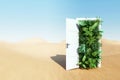 Open door in desert leading to tropical garden, green nature on desert background. Travel concept, teleport, fresh air, resort,