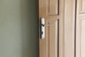 Open door, door handles and a wall Royalty Free Stock Photo