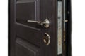 Open armored door. Door lock, Dark brown door closeup. Modern interior design, door handle. New house concept. Real estate.