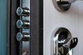 Open door of a family home. Close-up of the lock with your keys on an armored door. Security. Key cylinder, close up