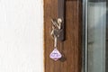 Open door with keys, key in keyhole, bedroom in background Royalty Free Stock Photo