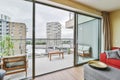 Open door leading to a stylish balcony