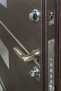 Open armored door. Door lock, Dark brown door closeup. Modern interior design, door handle. New house concept. Real estate.