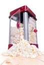 Open door popcorn popper with food pouring out