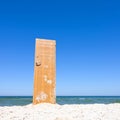 Open door to beach and blue sea Royalty Free Stock Photo