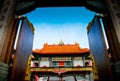 Open the door to Chinese Temple in Thailand