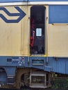 The Open Door of the Train Drivers Compartment on a Dutch Commuter Train being recycled at the Container terminal. Royalty Free Stock Photo