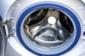 Open door of the washing machine close up. Home appliances Royalty Free Stock Photo