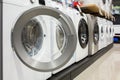 Open door of a washing machine in a household appliance store. Royalty Free Stock Photo