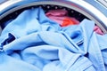 Open door of washing machine with laundry close up Royalty Free Stock Photo