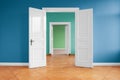 Open doors in empty apartment with colored walls Royalty Free Stock Photo