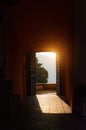 Through the open doors in the sunlight breaks an ancient fortress. Italy, Angera. Castle Rocca di Angera. Royalty Free Stock Photo