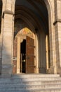 Open doorway to medieval catholic church. Gothic cathedral exterior. Open church entrance.