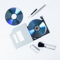 Open DVD-ROM tray with CD inside next to tools Royalty Free Stock Photo