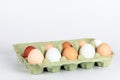 Open egg box with organic, free range chicken eggs in different colors. White, brown and dark brown eggs Royalty Free Stock Photo