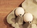 An open egg carton with two white eggs inside Royalty Free Stock Photo