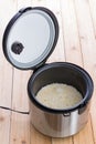 Open electric steamer pot with long grain rice