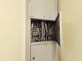 Open electrical distribution Cabinet. Lots of Cables, Wires inside metal box. Internet. Engineering Royalty Free Stock Photo