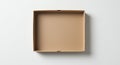 Open, empty cardboard box with a rectangular shape on a plain white surface. The Royalty Free Stock Photo