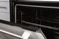 Open empty electric oven with rack Royalty Free Stock Photo