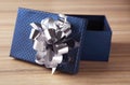 Open empty gift box with bow on table Royalty Free Stock Photo