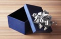 Open empty gift box with bow on table Royalty Free Stock Photo