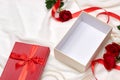 Open empty gift box. Red ribbon bow present with red roses on ho Royalty Free Stock Photo