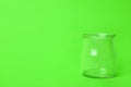 Open empty glass jar on green background, space for text Royalty Free Stock Photo