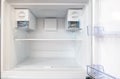 Open empty new white refrigerator inside fridge with shelves Royalty Free Stock Photo