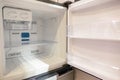 Open empty new white refrigerator inside fridge with shelves Royalty Free Stock Photo