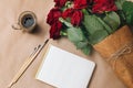 Open empty notebook with cup of coffee, brushes and bouquet of r Royalty Free Stock Photo