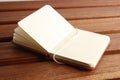 Open empty notebook on a wooden table Royalty Free Stock Photo