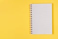 Open empty notebook on a yellow background. Top view Royalty Free Stock Photo