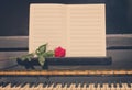 Open empty notes paper with red rose Royalty Free Stock Photo