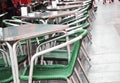 Open empty street cafe, tables and chairs with metal frame and wicker furniture, selective focus and close-up Royalty Free Stock Photo