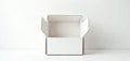 Open empty white cardboard box sits on clean white table. Product container with flaps open waits for items. Simple minimalist Royalty Free Stock Photo
